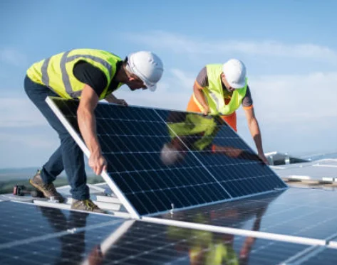industrial rooftop solar workers